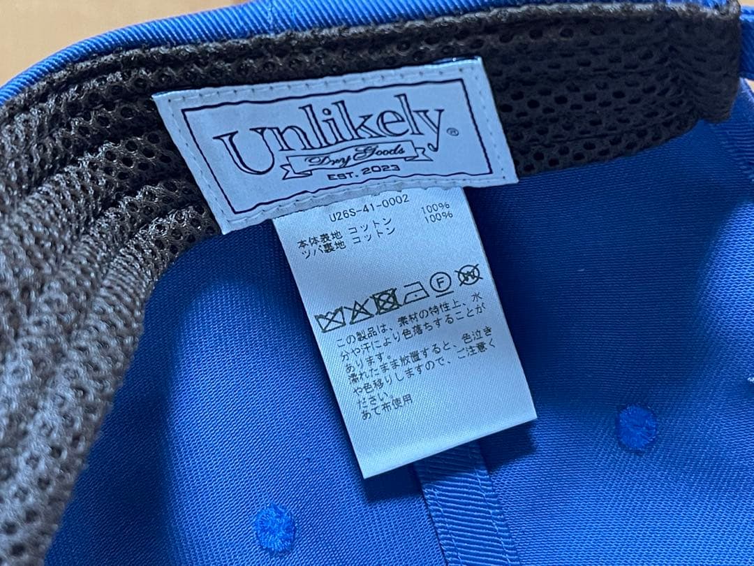 帽子 Unlikely Souvenir Cap \"WEST\" 26SS